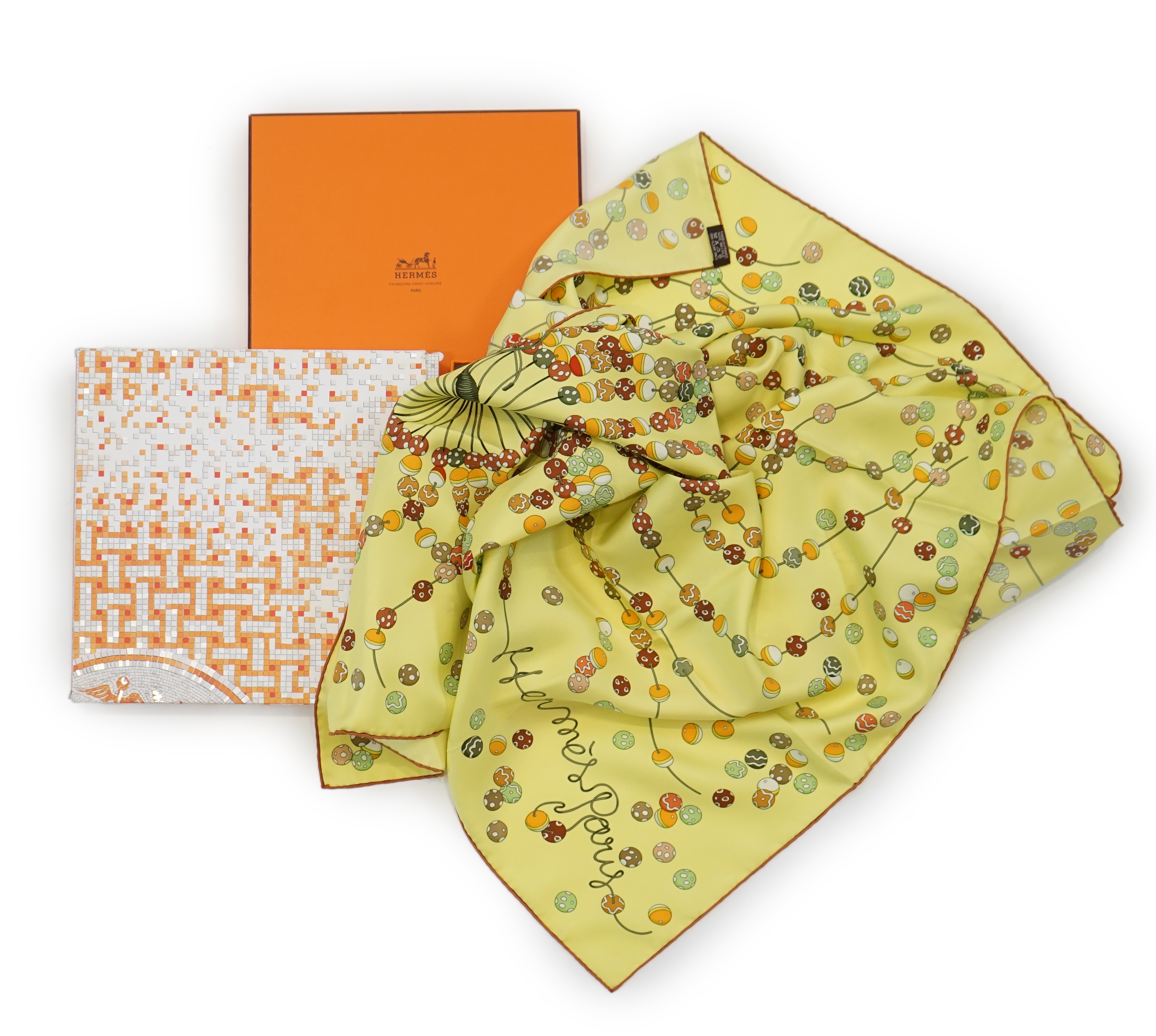 A yellow Hermès 'Dancing Pearls' silk scarf designed by Virginie Jamin, 90cm x 90cm